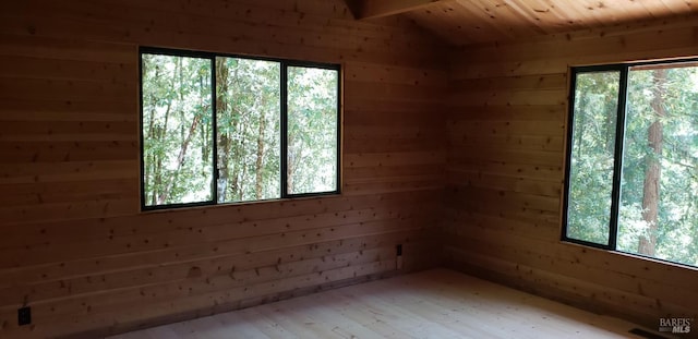 24663 Clover Rd, Willits, CA 95490 - unfurnished room featuring plenty of natural light, wooden walls, and wood finished floors