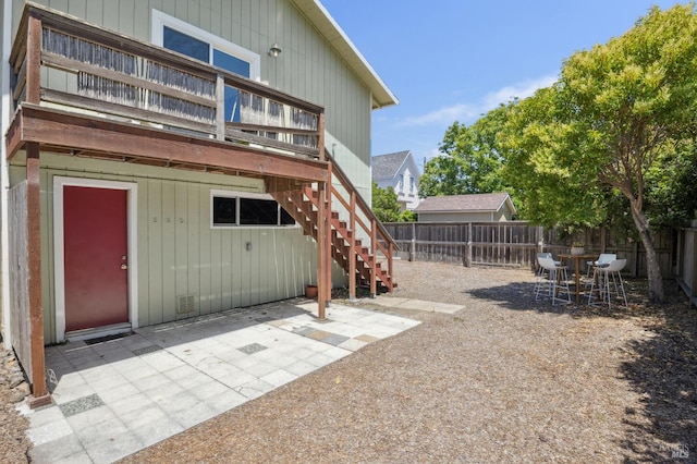 160 3rd St, Point Reyes Station, CA 94956 - rear view of property featuring a fenced backyard, a patio, stairway, and a deck