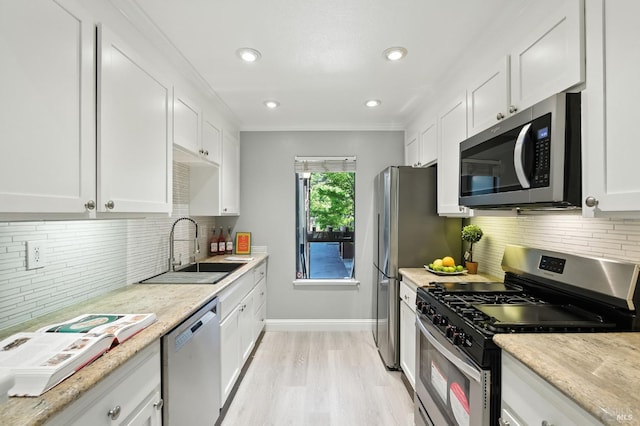 4 Cielo Ln Unit 3E, Novato, CA 94949 - kitchen featuring stainless steel appliances, white cabinets, backsplash, light wood finished floors, and light stone countertops
