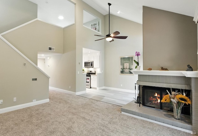 4 Cielo Ln Unit 3E, Novato, CA 94949 - living area with light carpet, ceiling fan, a fireplace, high vaulted ceiling, and recessed lighting