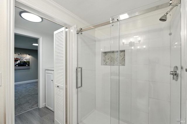 4 Cielo Ln Unit 3E, Novato, CA 94949 - bathroom with a stall shower, wood finished floors, and ornamental molding