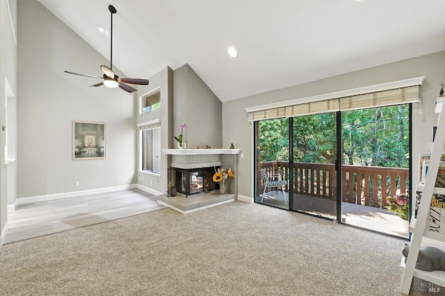 4 Cielo Ln Unit 3E, Novato, CA 94949 - unfurnished living room featuring carpet, plenty of natural light, high vaulted ceiling, a ceiling fan, and a tile fireplace