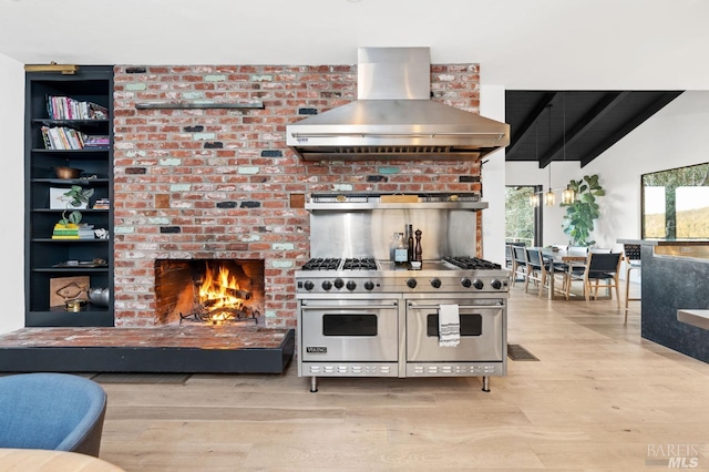 1325 Crestmont Dr, Angwin, CA 94508 - kitchen featuring wall chimney range hood, double oven range, light wood-style flooring, and a brick fireplace