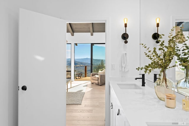 1325 Crestmont Dr, Angwin, CA 94508 - bathroom featuring a mountain view, double vanity, wood finished floors, and a wooden ceiling with exposed beams
