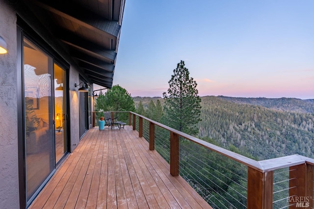 1325 Crestmont Dr, Angwin, CA 94508 - deck at dusk featuring a view of trees and a mountain view