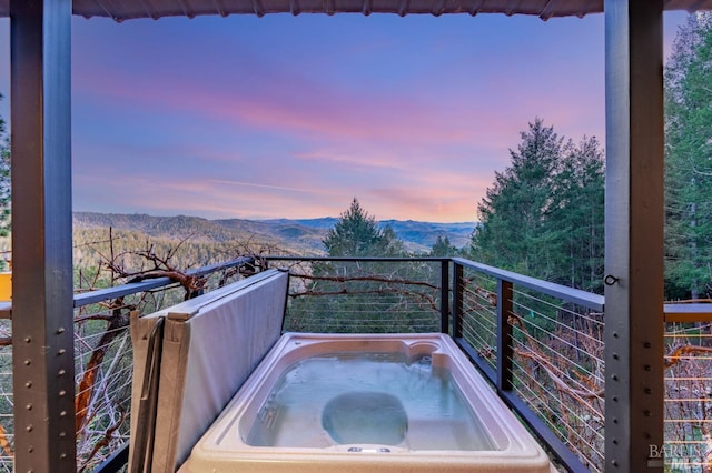 1325 Crestmont Dr, Angwin, CA 94508 - balcony at dusk featuring a hot tub and a mountain view