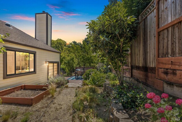 1619 Foothill Blvd, Calistoga, CA 94515 - yard at dusk with a vegetable garden and a patio