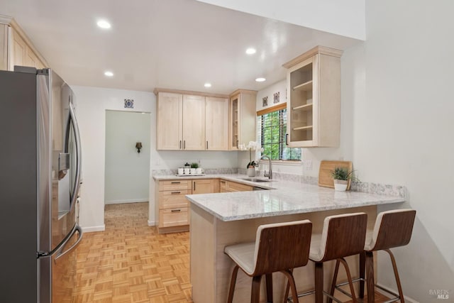1619 Foothill Blvd, Calistoga, CA 94515 - kitchen featuring stainless steel refrigerator with ice dispenser, a peninsula, light brown cabinetry, and recessed lighting
