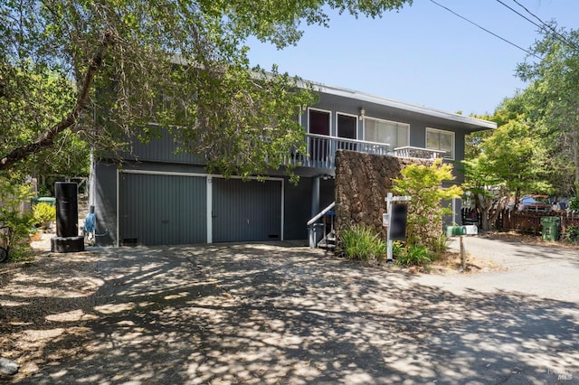 15 Montecito Dr, Corte Madera, CA 94925 - view of front of house featuring asphalt driveway and a garage