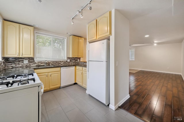 711 San Anselmo Ave, San Anselmo, CA 94960 - kitchen with white appliances, track lighting, backsplash, and dark countertops