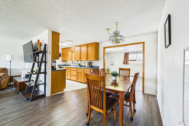 2393 Ohio St, Eureka, CA 95501 - dining room with dark wood-type flooring, a textured ceiling, and a chandelier
