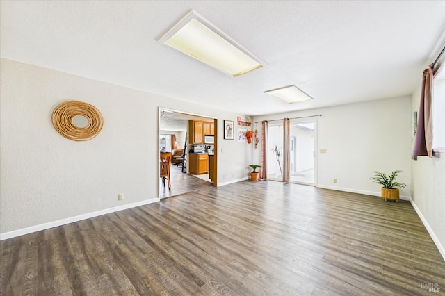 2393 Ohio St, Eureka, CA 95501 - unfurnished living room with dark wood-type flooring and baseboards