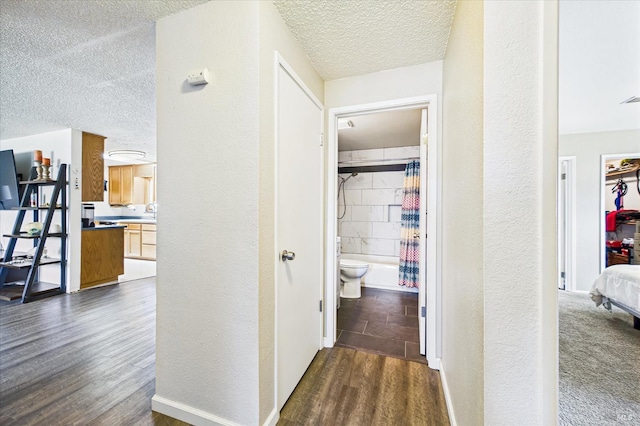 2393 Ohio St, Eureka, CA 95501 - corridor featuring a textured ceiling, a textured wall, and dark wood finished floors