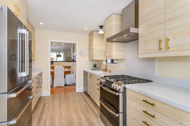 1 Drakes View Cir, Greenbrae, CA 94904 - kitchen featuring appliances with stainless steel finishes, wall chimney range hood, light brown cabinets, light wood-style floors, and recessed lighting