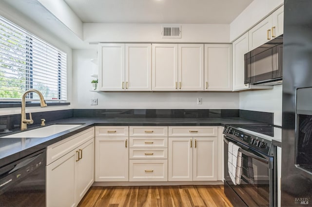 14 Summerhill Way, San Rafael, CA 94903 - kitchen with black appliances, open shelves, white cabinetry, and dark countertops