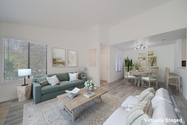 1801 Marshall Rd Unit 808, Vacaville, CA 95687 - living area featuring wood finished floors, plenty of natural light, and a chandelier