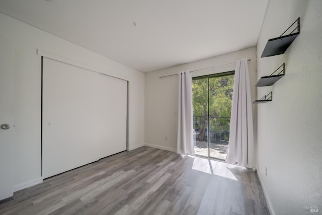1801 Marshall Rd Unit 808, Vacaville, CA 95687 - unfurnished bedroom featuring wood finished floors, access to exterior, and a closet