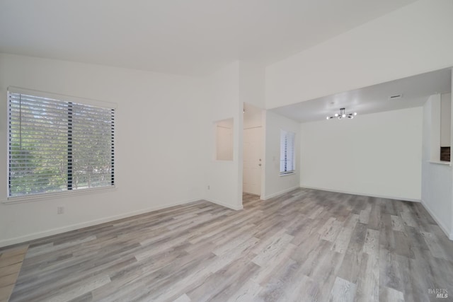 1801 Marshall Rd Unit 808, Vacaville, CA 95687 - unfurnished living room with light wood finished floors and a chandelier