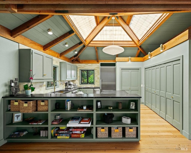 11 Walla Vis, Stinson Beach, CA 94970 - kitchen featuring open shelves, dark countertops, light wood-type flooring, beam ceiling, and a peninsula