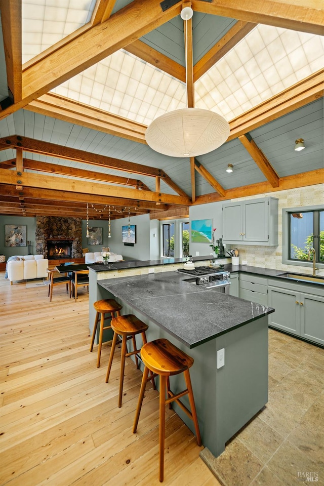 11 Walla Vis, Stinson Beach, CA 94970 - kitchen with a kitchen breakfast bar, tasteful backsplash, light wood-type flooring, gas stove, and a peninsula