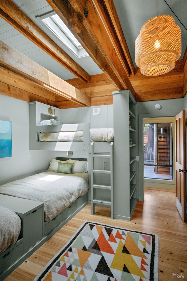 11 Walla Vis, Stinson Beach, CA 94970 - bedroom featuring beam ceiling, wood finished floors, and a skylight