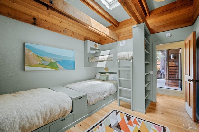 11 Walla Vis, Stinson Beach, CA 94970 - bedroom with beam ceiling, a skylight, and light wood-style flooring