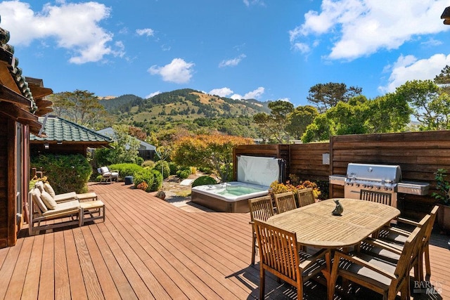 11 Walla Vis, Stinson Beach, CA 94970 - deck with a covered hot tub, a mountain view, a grill, and outdoor dining area