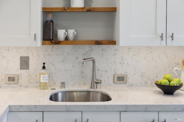 14 Corte Real Ct, Greenbrae, CA 94904 - kitchen with open shelves, white cabinetry, decorative backsplash, and light stone countertops