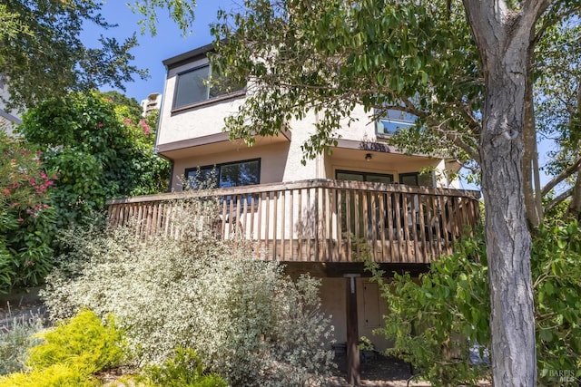 14 Corte Real Ct, Greenbrae, CA 94904 - rear view of house featuring stucco siding and a deck