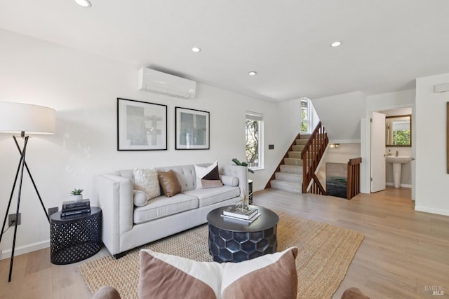 14 Corte Real Ct, Greenbrae, CA 94904 - living room with an AC wall unit, light wood-style flooring, recessed lighting, and stairs