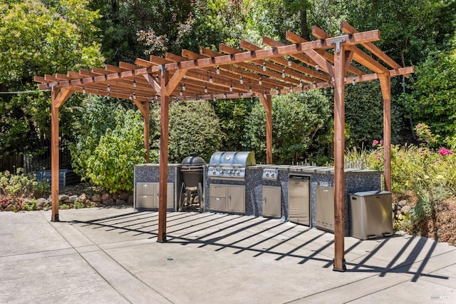 71 Convent Ct, San Rafael, CA 94901 - view of patio with exterior kitchen, a pergola, and view of scattered trees