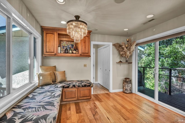 18903 N Shore Dr, Hidden Valley Lake, CA 95467 - living area with healthy amount of natural light, light wood-style floors, a chandelier, and recessed lighting