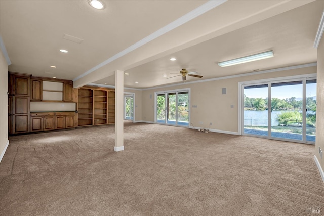 18903 N Shore Dr, Hidden Valley Lake, CA 95467 - unfurnished living room with crown molding, light colored carpet, a water view, recessed lighting, and plenty of natural light