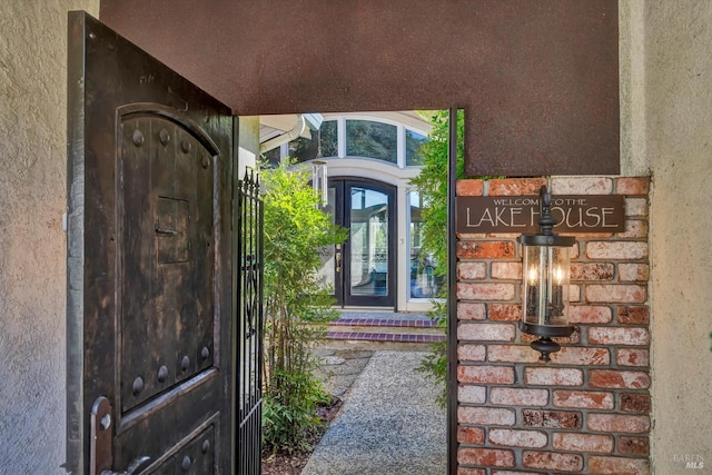 18903 N Shore Dr, Hidden Valley Lake, CA 95467 - doorway to property featuring stucco siding and brick siding