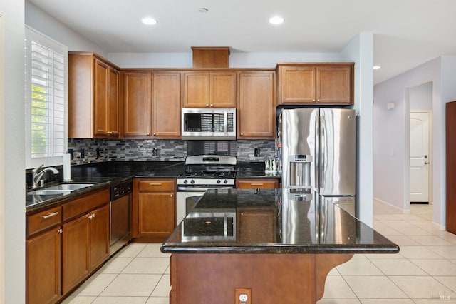 448 Potters Ln, Vacaville, CA 95687 - kitchen with appliances with stainless steel finishes, tasteful backsplash, light tile patterned flooring, a kitchen island, and recessed lighting