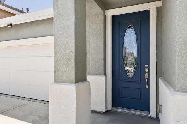 448 Potters Ln, Vacaville, CA 95687 - doorway to property with stucco siding and a garage