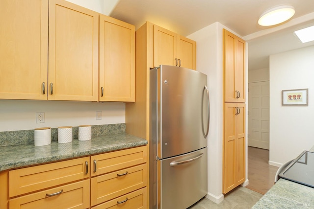 495 S Eliseo Dr Unit 7, Greenbrae, CA 94904 - kitchen with freestanding refrigerator, light brown cabinets, and range with electric cooktop