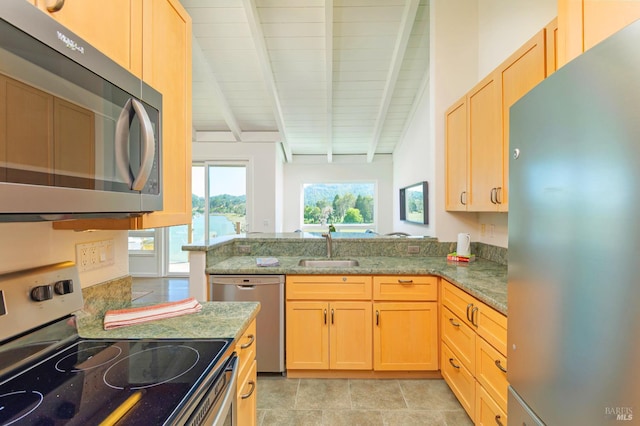 495 S Eliseo Dr Unit 7, Greenbrae, CA 94904 - kitchen with appliances with stainless steel finishes, light brown cabinetry, light stone counters, and a peninsula