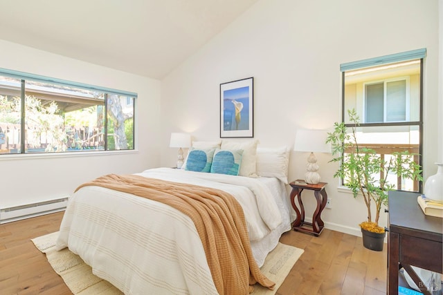 495 S Eliseo Dr Unit 7, Greenbrae, CA 94904 - bedroom featuring a baseboard heating unit, lofted ceiling, and wood-type flooring