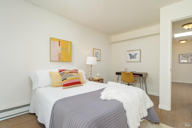 495 S Eliseo Dr Unit 7, Greenbrae, CA 94904 - bedroom with baseboard heating and wood finished floors