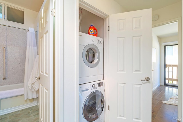 495 S Eliseo Dr Unit 7, Greenbrae, CA 94904 - washroom featuring stacked washing machine and dryer and baseboards