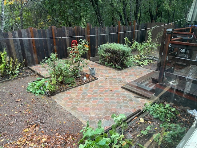 5820 Ruddock Rd N, Philo, CA 95466 - fenced backyard featuring a patio area and a garden