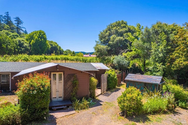 5820 Ruddock Rd N, Philo, CA 95466 - view of front facade with french doors and an outdoor structure