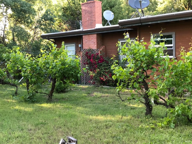 5820 Ruddock Rd N, Philo, CA 95466 - view of property exterior with a chimney and a lawn
