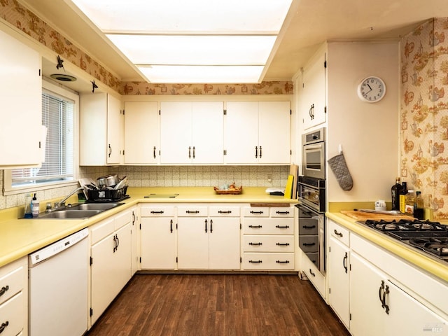 5820 Ruddock Rd N, Philo, CA 95466 - kitchen featuring dishwasher, wallpapered walls, dark wood-style floors, oven, and light countertops