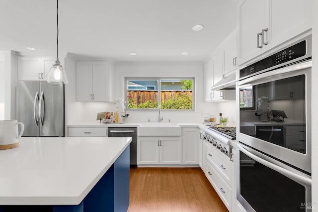 251 Donegal Way, Martinez, CA 94553 - kitchen featuring stainless steel appliances, light wood-style floors, backsplash, white cabinets, and recessed lighting