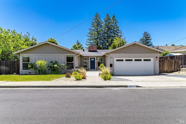 251 Donegal Way, Martinez, CA 94553 - ranch-style house with an attached garage, a chimney, concrete driveway, and board and batten siding