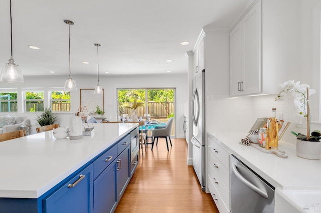 251 Donegal Way, Martinez, CA 94553 - kitchen featuring stainless steel appliances, blue cabinetry, white cabinetry, decorative backsplash, and light countertops