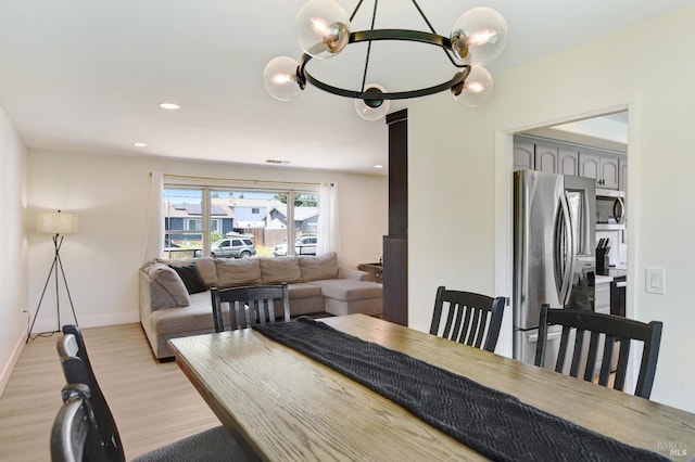 196 Caldwell Dr, Vacaville, CA 95687 - dining space with light wood-type flooring, a chandelier, and recessed lighting