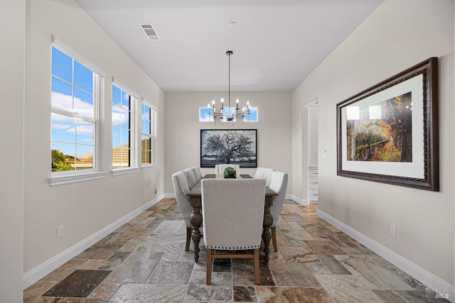 5313 Autumn Rock Ct, Fairfield, CA 94534 - dining room featuring stone tile floors and a chandelier